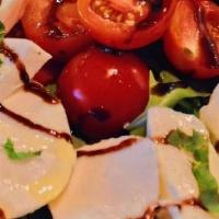Caprese Salad · Fresh Mozzarella, Arugula, Cherry Tomatoes, Balsamic Reduction, EVOO