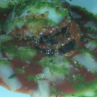 Melanzane Ferrari · Roasted eggplant, San Marzano tomato sauce, grana padano, baked and drizzled with a basil pe...