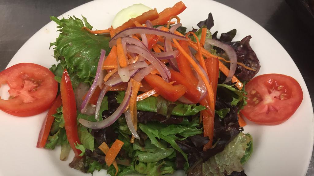 Insalata Primavera · Mixed greens, sliced Roma tomatoes, red onions, cucumber, red pepper, julienne carrots tossed with extra virgin olive oil, balsamic vinegar, lemon juice.