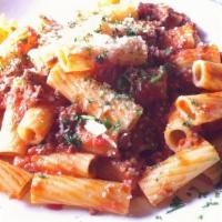 Penne All' Arrabbiata · Red pepper and garlic spiced tomato sauce, served over penne pasta.