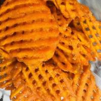 Sweet Potato Fries · Crispy and crunchy waffle fries.