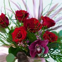 Classic Sophisticated Rose Half Dozen · Our luscious roses sing in our classic colored half dozen wrapped bouquet.