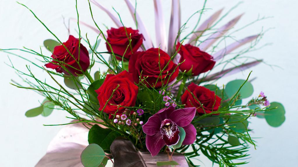 Classic Sophisticated Rose Half Dozen · Our luscious roses sing in our classic colored half dozen wrapped bouquet.