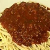 Spaghetti · Homemade meat sauce smothers a mountain of noodles. Includes side salad and garlic bread.