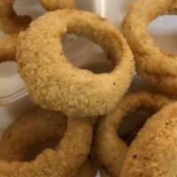 Onion Rings · A generous portion of our own battered onion rings served with our spicy ranch sauce.
