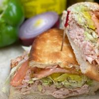 Turkey Club · Half turkey, half ham, and a touch of bacon. All sandwiches come with lettuce, onion, tomato...