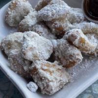 Art’S Famous Fried Biscuits · Crisp on the outside, warm and flakey on the inside, served southern style with powdered sug...