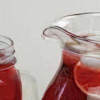 Sorrel Sweet Tea · Fresh homemade Jamaican Sweet Sorrel Tea made with ginger, hibiscus flower, lime and other i...
