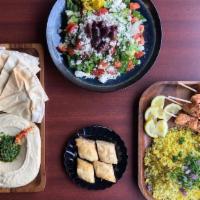 Chicken Kabob Fam Meal · A family meal to take home that includes Mediterranean Rice, Hommous with Pita Bread, a Gree...