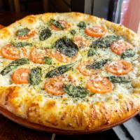 Margherita Pizza · Sliced tomatoes, Fresh garlic, Fresh basil, Parmesan, Mozzarella, and Provolone cheese.