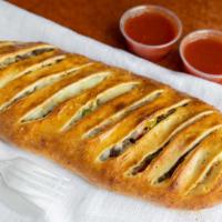 Veggie Stromboli · Mushrooms, Onions, Green Peppers, Banana Peppers, Tomatoes, Black Olives, and Mozzarella Che...