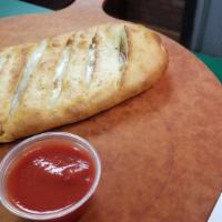 Greek Stromboli · Gyro Meat, Banana Peppers, Onions, Olives, Feta Cheese, and Mozzarella Cheese.