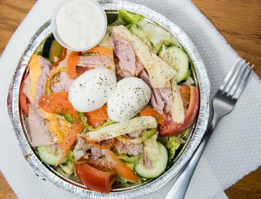 Julienne Salad · Fresh garden crisp greens topped with ham, turkey, American and swiss cheese, hard boiled egg, cucumber, carrots and tomatoes.