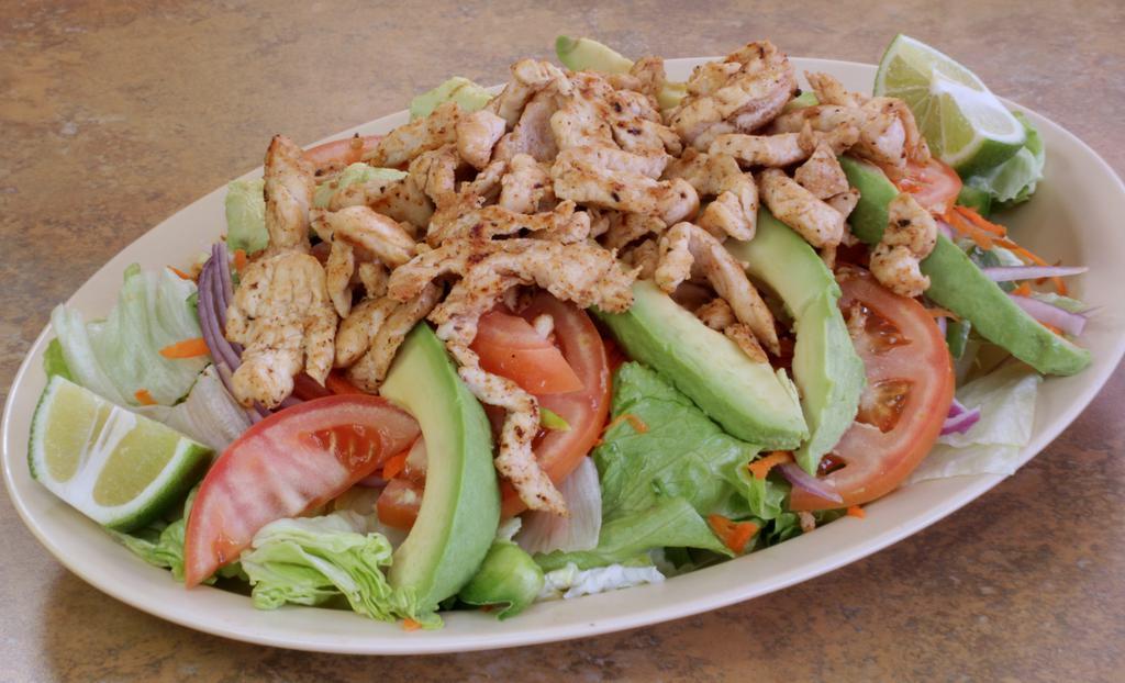 Grilled Chicken Salad · Lettuce, tomatoes, avocado, onions, bell pepper and shredded carrots.