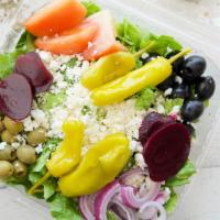 Greek Salad · Romaine lettuce, black and green olives, red onions, tomatoes, beets, pepperoncini, and feta...