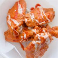Traditional Chicken Wings · Deep-fried chicken wings with your choice of sauce.