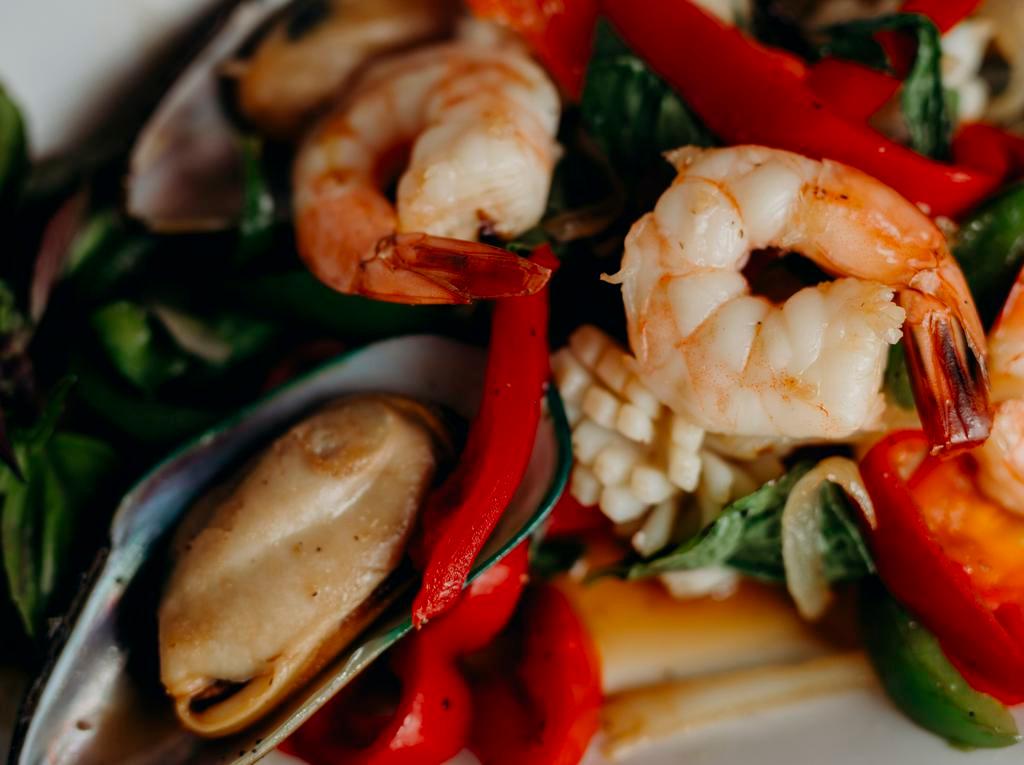 Seafood Basil · Spicy. Stir fried shrimp, squid, and mussels with bell peppers and onions in spicy basil sauce.
