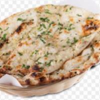Garlic Naan · Clay oven baked bread brushed with fresh garlic.