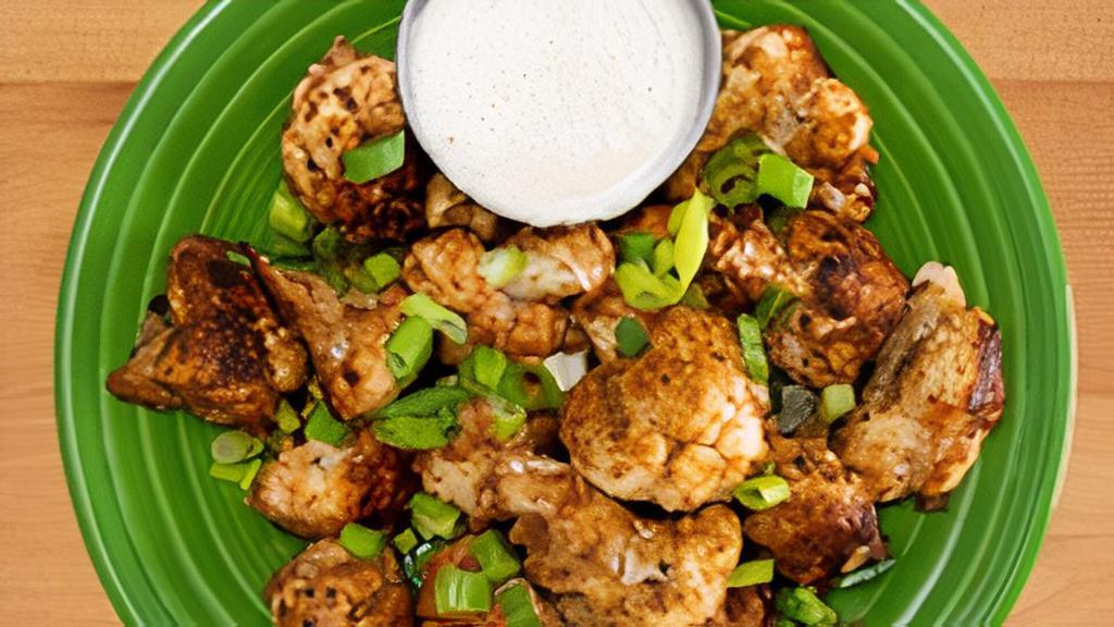 I Am Zesty (Buffalo Cauliflower Bites) · Gluten Free baked cauliflower bites, tossed in our spicy buffalo sauce and grilled crispy, garnished with green onions and accompanied with celery sticks and a side of cashew ranch dipping sauce.