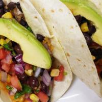 Veggie Tacos · Three soft tacos with rice, black beans, corn, avocado and pico de gallo.