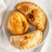  Argentinian Empanadas  · Ground Beef with eggs, pepper, onions and spices
Fugazetta with caramelized onion and mozzar...