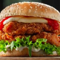 Crispy Chicken Sandwich · Delicious sandwich topped with breaded and fried chicken with melted cheese, lettuce, tomato...
