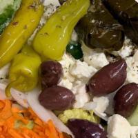 Greek Salad · Feta cheese, Kalamata olives, grape leaves, pepperoncini peppers, oregano, tomato, cucumber,...