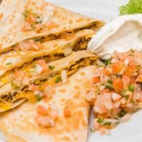 Buenos Dias Quesadillas · A tortilla filled with scrambled eggs, chorizo sausage, Monterey jack and cheddar cheese. Se...