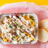 Chicken Bacon Ranch Mac 'N' Cheese (Family) · Cheddar, Mozzarella, Seasoned Baked Chicken Breast, Topped with Bacon, Ranch Dressing & Brea...