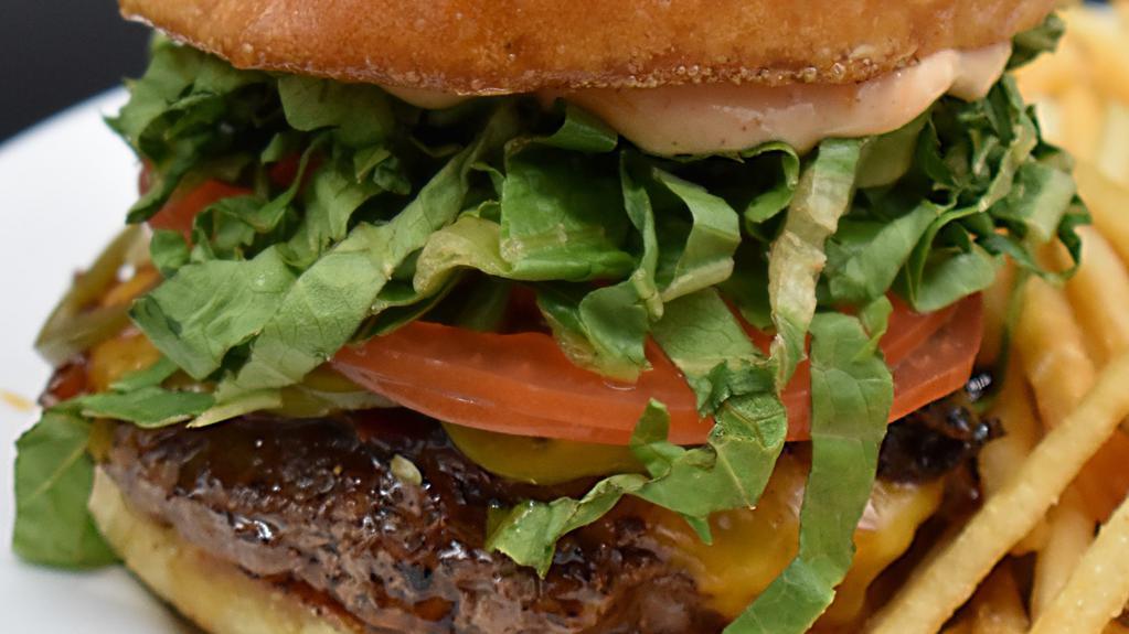 Bricks Burger · Smoked cheddar, bacon jam, romaine lettuce, tomato, pickled jalapeños, sriracha remoulade. Add sides or toppings for an additional charge.