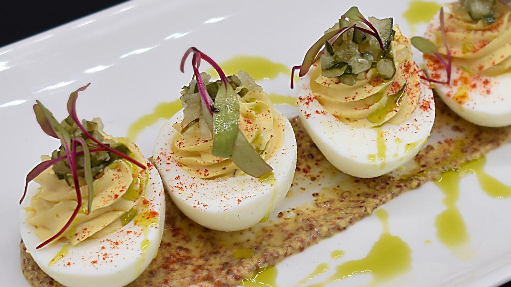 Deviled Eggs · Gluten-Free. Creole mustard, house-pickle relish, micro greens, herb oil vinaigrette, smoked paprika
