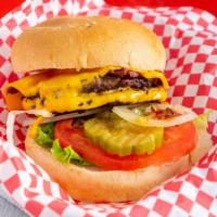 Quickies Favorite · Double cheeseburger, bacon, lettuce, tomato, onion, pickles and 1000 island dressing.