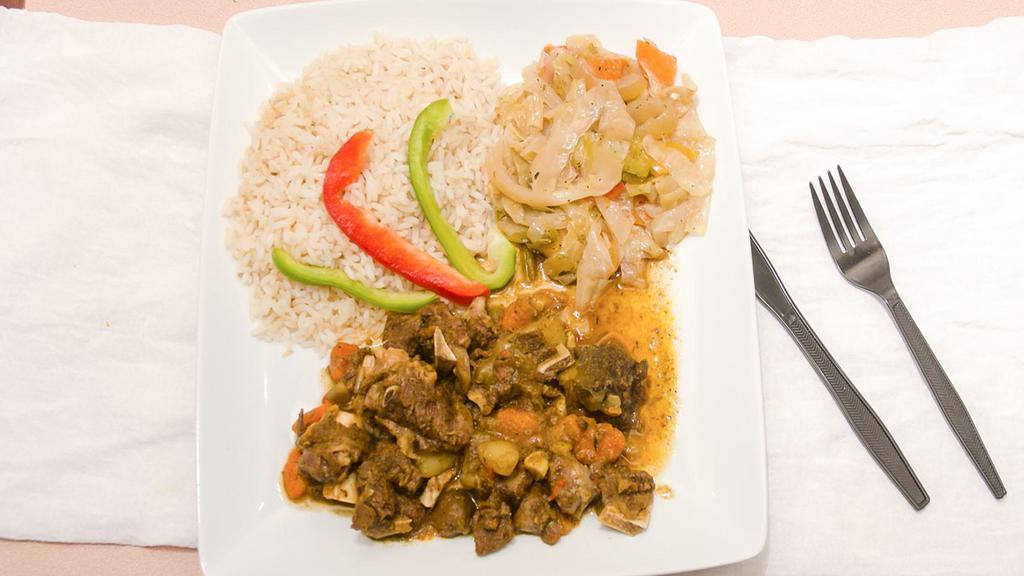 Curry Goat · Goat meat simmered down in curry and savory spices until meat is tender.