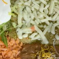 Green Enchiladas · 3 chicken or ground beef enchiladas with green salsa, rice,beans, lettuce,tomatoe, cheesse a...