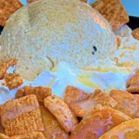 Frosted Cini Minis · Mini pancakes topped with cinnamon ice cream, cream cheese glaze, cinnamon toast crunch, and...