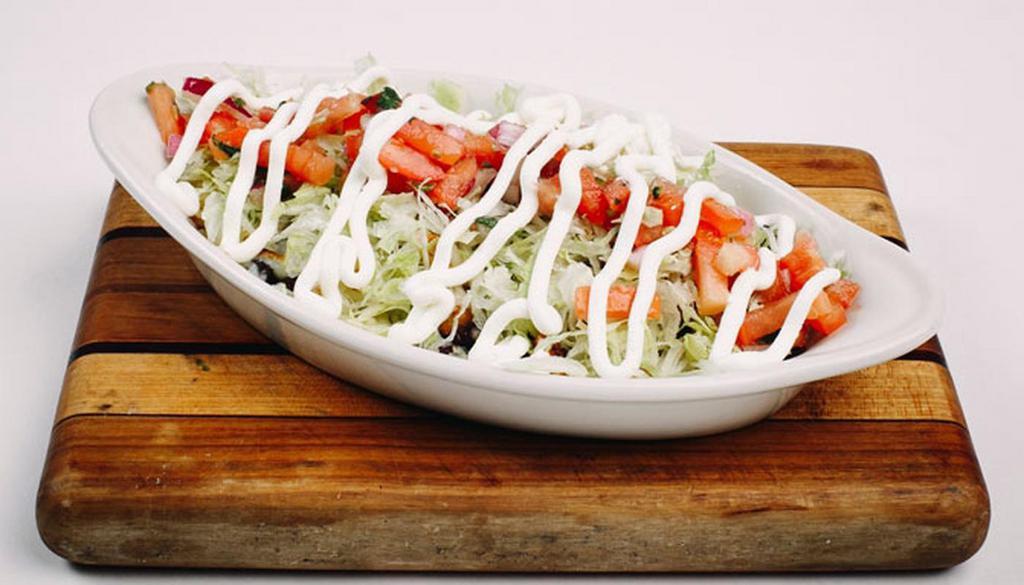 Bowl · Baja rice and corn, black beans, shredded cheese, lettuce, pico de gallo and sour cream with your choice of protein