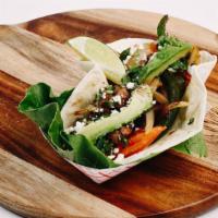 Steak Fajita Taco · Marinated steak served with grilled onions, peppers, tomatoes, avocado slices, cilantro, fet...
