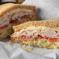 Turkey & Swiss Sandwich · Oven gold turkey and Swiss cheese on multigrain bread. Topped off with lettuce, tomatoes, re...