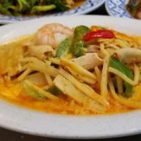 Gang Gai  · Thai red curry, cooked with bamboo shoots, green peppers in coconut milk.