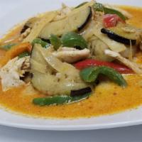 Pad Ped · Green peppers, eggplant, bamboo shoots, onion stir-fried with coconut milk and red curry sau...