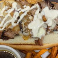 The Kg Dip Sandwich · Shaved, smoked basket served on an open-face hoagie roll, topped with grilled onions, provol...