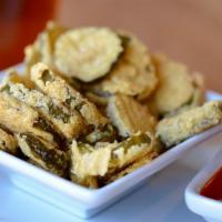 Fried Pickles · Hand dipped, sliced, dill pickle chips with a kick of chipotle seasoning.