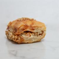 Walnut & Pistachio Baklava Square · 1 piece. Crispy, sweet phyllo dough layered with walnuts & pistachio. Vegan.