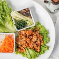 Lettuce Wraps · Tender meat, fresh veggies, and gochujang sauce wrapped in green leaf lettuce choice of beef...