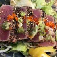 Mebachi · Peppered big eye tuna seared and served on a bed of spring mix with ponzu and yuzu sauces.