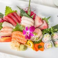 Sashimi Dinner Deluxe · 16 pieces of chef’s choice sashimi served with a California roll.