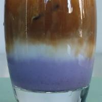 Taro Latte · Taro, milk and espresso. This purple drink is preferred over ice, however, served hot is als...