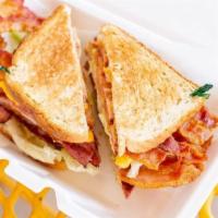 Ham & Cheese Club With Bacon Sandwich · On Texas toast with grilled ham, cheese, bacon,  mayonnaise, lettuce, and tomato. Served wit...