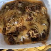 Burrito Plate · Burrito smothered in homemade chili, topped with grated cheese, nacho cheese flavored chips,...