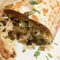 Burrito Asada · Skirt steak a flour tortilla wrap, served with lettuce,tomato,Mexican rice ,beans, sour crea...